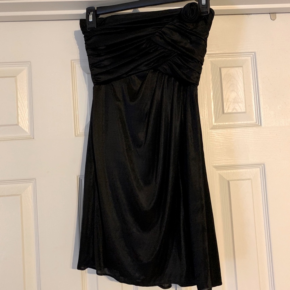 Strapless black cocktail dress.